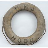 HMS Hood- an early 20th century grey canvas and rope life preserver:, black text to body 'HMS Hood',