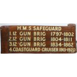 A wooden wall plaque from the Royal Navy shore base HMS Safeguard:,