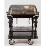 A silver plated carvery trolley: the domed cover enclosing a fitted interior with heated tray and