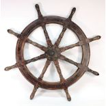 A teak and iron ship's helm:, 100cm diameter.