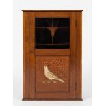 An early 20th century display cabinet crafted from a section of a rowing skull:,