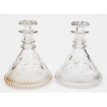 A pair of cut glass ship's decanters:, of typical form with mushroom stoppers ,