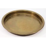 A circular brass serving tray from the Holland America Line liner SS Nieuw Amsterdam:,