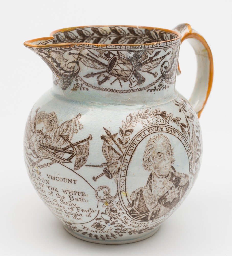 A 19th century pearlware Nelson commemorative jug:, with portraits of Lord Nelson and HMS Victory,