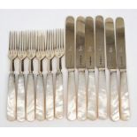 A set of twelve Victorian silver gilt and mother of pearl fruit knives and forks,