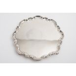 A George V silver salver, maker Harold Atkin, Sheffield, 1930: with moulded wavy edge border,