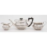 A George V silver three-piece tea service, maker William Hutton & Sons Ltd, Sheffield,