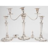 A  Victorian silver  twin-branch candelabra and two matching candlesticks, maker Hawksworth,