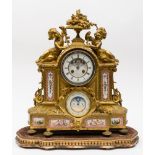 A large French ormolu and porcelain mantel clock: the eight-day duration movement striking the