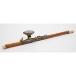 A Chinese bamboo opium pipe: with ivory end and mouthpiece, the white metal,