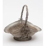 A silver plated fruit basket: of woven wire work design with loop carrying handle,