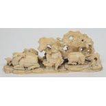 A Chinese carved ivory figure group: of a farmer seated below a tree with cattle, 8.5cm.