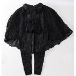 A Victorian black lace and silk embroidered mourning jacket:..