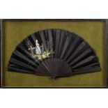 A late 19th century black satin fan: the leaf painted with a figure of a young woman leaning on a