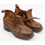A pair of early 20th century brown leather and canvas cross country ski boots, size 12:,
