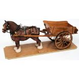 A Beswick model of a Shire horse mounted with a scale model of a hay cart on a wooden plinth:,