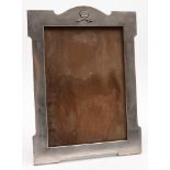 An Eastern white metal photograph frame with crown and sabre decoration:, 40 cm high.