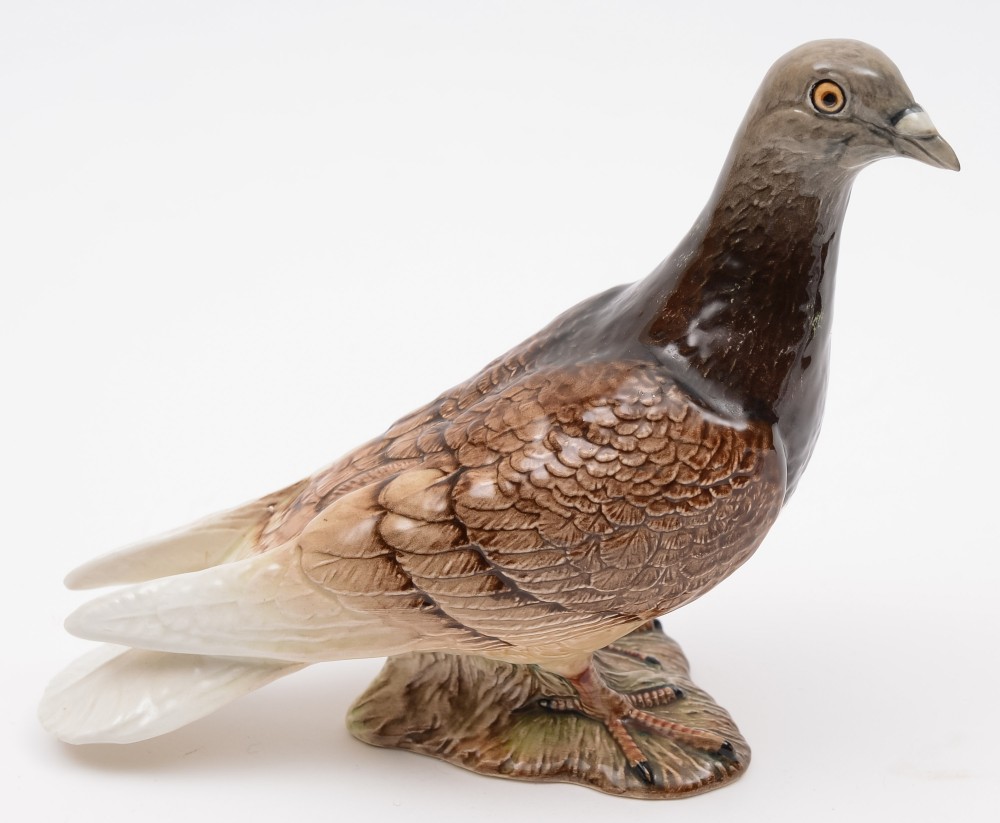 A Beswick model of a pigeon:, with brown and cream plumage and grey head and beak,