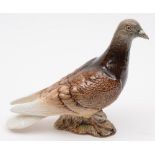 A Beswick model of a pigeon:, with brown and cream plumage and grey head and beak,