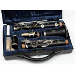 An ebony five section clarinet by  Buffet Crampon & Cie,