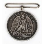 An 1815 Waterloo medal, indistinctly stamped 1st Batt. 27th Regt. Foot:, altered suspension..