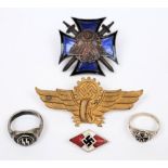 A Third Reich period National Socialist Party enamel badge, together with two rings,