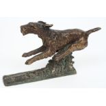 An early 20th century cold painted bronze of a leaping Terrier signed K Salat:,