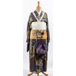 An early 20th century Japanese kimono, on a period mannequin,