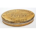 An 18th century horn oval snuff box,:, the cover inscribed 'Christr Simner Farrier, Denbigh',