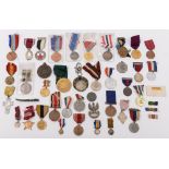 A collection of various military and civilian medals,