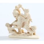 A Japanese carved ivory okimono: in the form of a shouting man fending off four monkeys from his