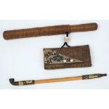 An early 20th Century Japanese bamboo and metal mounted opium pipe:, in a woven wicker case,