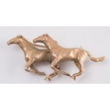 A 9ct yellow gold 'galloping horses' brooch:, approximately 20gms gross weight.