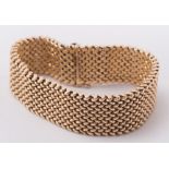 An 18ct gold mesh-link bracelet:, approximately 44gms gross weight.