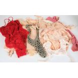 A collection of early 20th century silk stockings, lady's underwear, corsets:, etc.