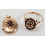 A 9ct gold and garnet oval cluster ring and a gold and gem-set pendant locket:.