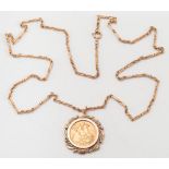 An Elizabeth II sovereign dated '1974' mounted as a pendant: within a gold acorn design frame,
