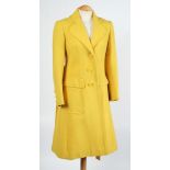 A 'Diorling' yellow overcoat:.