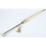 A silk parasol with faux bamboo and jade handle:.