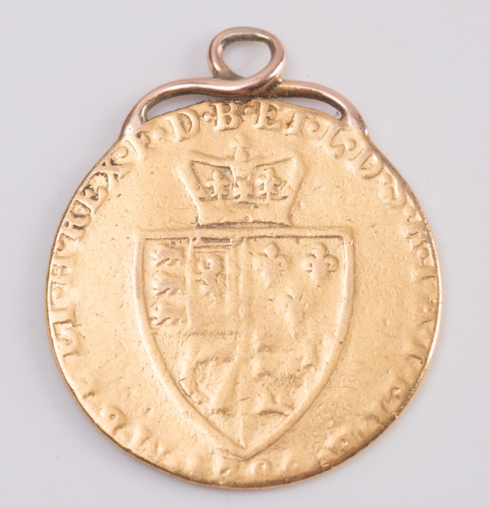 A George III spade guinea pendant:, marks worn.