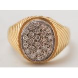 A gentleman's 18ct gold and diamond oval cluster ring:, approximately 17gms gross weight.