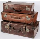 A large leather suitcase and two other suitcases: (3)