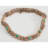 A gold and turquoise mounted three bar gate-link bracelet:, each link with a single, oval turquoise.