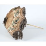 A late Victorian silk fringed parasol: with turned wood handle.