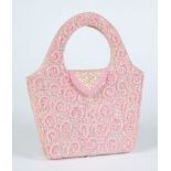 A pink beadwork hand bag:.