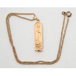 A gold Egyptian ingot pendant:, approximately 9.5gms gross weight.