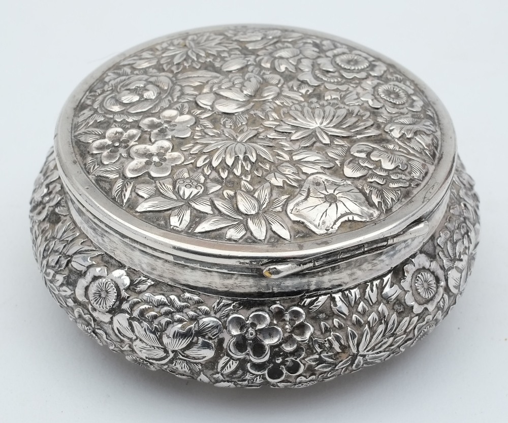 A Chinese silver powder box, maker Wang Hing & Co, Hong Kong: of circular form,