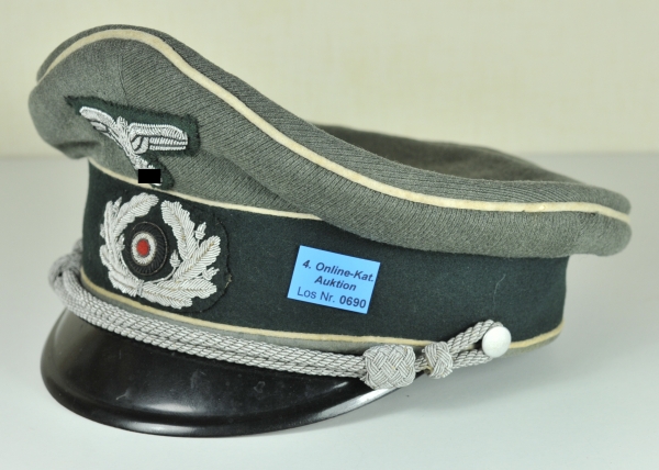 Visor Cap for Leutnant of the Infantery Erwin Schmelzer. Fine field grey fabric, dark green band,