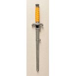 Army Officers Dagger Miniature. Nickeled fittings, blance blade, amber colored grip, in scabbard.