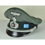 Visor Cap for Officers of the Mountain Troops. Field grey fabric, dark green band, green piping,